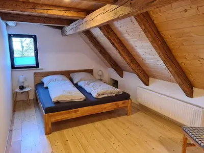 Ein Bett oder Betten in einem Zimmer der Unterkunft Ferienhaus Waldglück