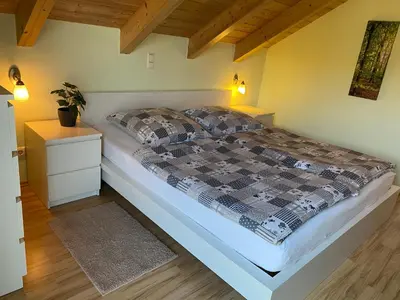 Ein Bett oder Betten in einem Zimmer der Unterkunft Haus am See Ferienhaus 4