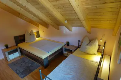 Ein Bett oder Betten in einem Zimmer der Unterkunft Haus am See Ferienhaus 4