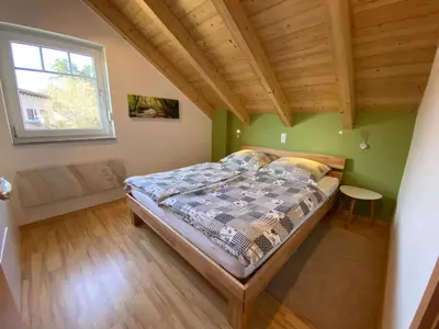 Ein Bett oder Betten in einem Zimmer der Unterkunft Haus am See Ferienhaus 4