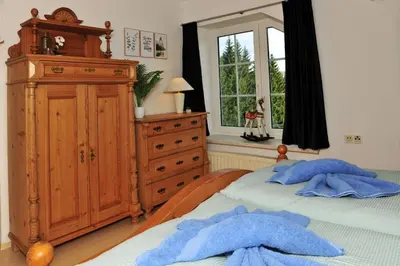 Ein Bett oder Betten in einem Zimmer der Unterkunft Exklusives Ferienhaus 