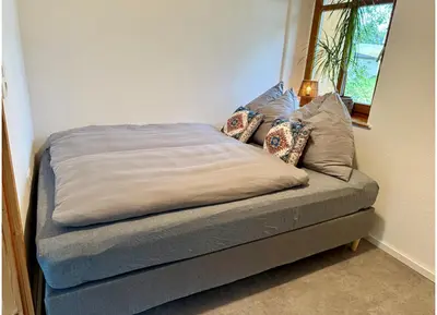 Ein Bett oder Betten in einem Zimmer der Unterkunft Ferienwohnung Scharfenberg