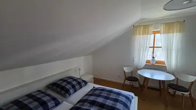 Ein Bett oder Betten in einem Zimmer der Unterkunft Ferienwohnung Dirscherl