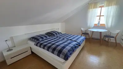 Ein Bett oder Betten in einem Zimmer der Unterkunft Ferienwohnung Dirscherl