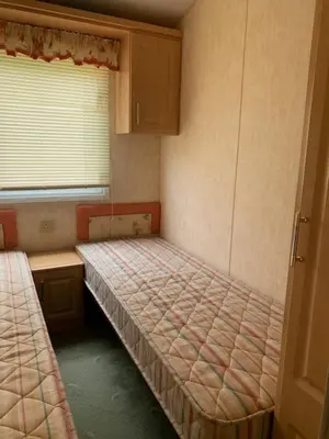 Ein Bett oder Betten in einem Zimmer der Unterkunft Ferienhaus im Villengarten