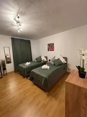 Ein Bett oder Betten in einem Zimmer der Unterkunft City 2-Zimmer Apartment mit Balkon