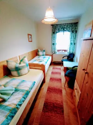 Ein Bett oder Betten in einem Zimmer der Unterkunft Ferienwohnung Im Wiesenthal