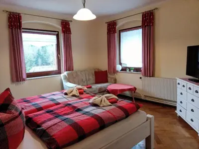 Ein Bett oder Betten in einem Zimmer der Unterkunft Ferienwohnung Im Wiesenthal