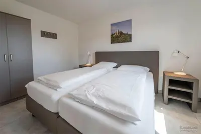Ein Bett oder Betten in einem Zimmer der Unterkunft Panoramahaus Premium Typ 100