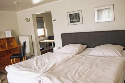 Ein Bett oder Betten in einem Zimmer der Unterkunft Pension Apart