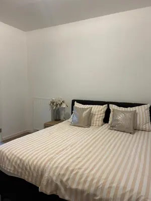 Ein Bett oder Betten in einem Zimmer der Unterkunft Schöne Ferienwohnung im Zentrum