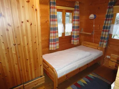 Ein Bett oder Betten in einem Zimmer der Unterkunft Ferienhaus Weil