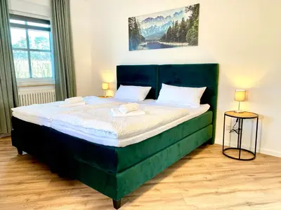 Ein Bett oder Betten in einem Zimmer der Unterkunft Ferienhaus Bayreuth für 10 Personen mit Garten