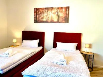 Ein Bett oder Betten in einem Zimmer der Unterkunft Gästehaus Bayreuth
