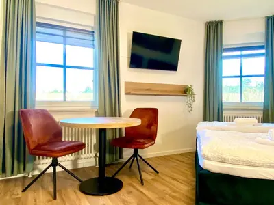 Ein Bett oder Betten in einem Zimmer der Unterkunft Gästehaus Bayreuth