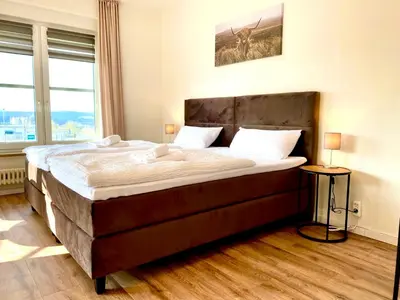 Ein Bett oder Betten in einem Zimmer der Unterkunft Gästehaus Bayreuth