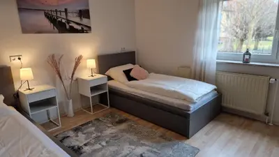 Ein Bett oder Betten in einem Zimmer der Unterkunft Helle gemütliche 3-Zi-Whg mit Terrasse und Gartenzugang