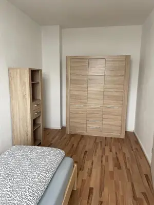 Ein Bett oder Betten in einem Zimmer der Unterkunft 4 Raum Wohnung mit Balkon u Badewanne Phil 3