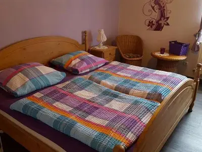 Ein Bett oder Betten in einem Zimmer der Unterkunft Ferienwohnung Spitzner