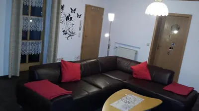Ein Sitzbereich in der Unterkunft Ferienwohnung Spitzner