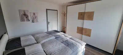 Ein Bett oder Betten in einem Zimmer der Unterkunft FeWo Süß