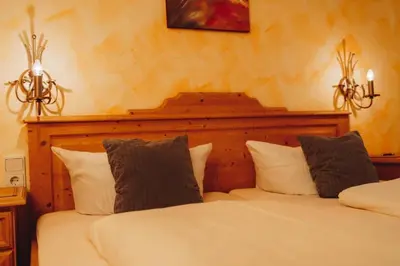 Ein Bett oder Betten in einem Zimmer der Unterkunft Landhotel Neukirchner Hof