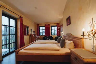 Ein Bett oder Betten in einem Zimmer der Unterkunft Landhotel Neukirchner Hof