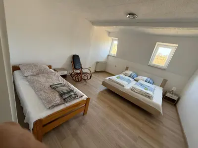 Ein Bett oder Betten in einem Zimmer der Unterkunft Ferienwohnung Goldener Drache