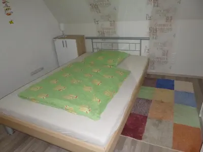Ein Bett oder Betten in einem Zimmer der Unterkunft Ferienhaus Lisa