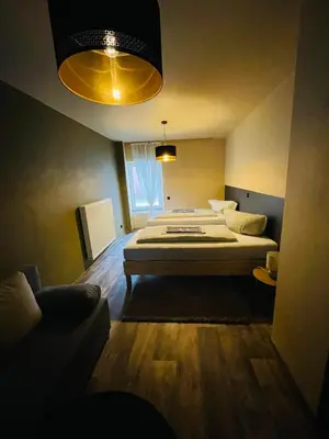 Ein Bett oder Betten in einem Zimmer der Unterkunft Familien-Apartments Boulevard