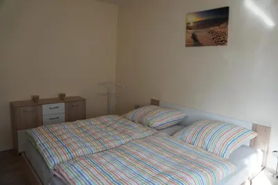 Ein Bett oder Betten in einem Zimmer der Unterkunft Ferienwohnung Sebald