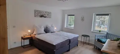 Ein Bett oder Betten in einem Zimmer der Unterkunft gemütliche Ferienwohnung Achteltal