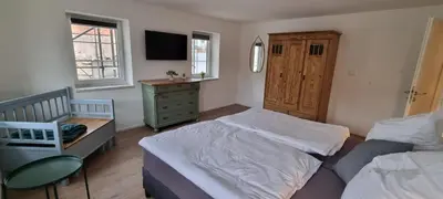 Ein Bett oder Betten in einem Zimmer der Unterkunft gemütliche Ferienwohnung Achteltal