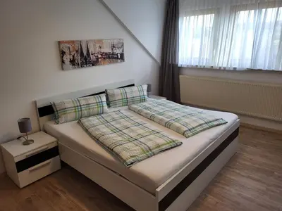Ein Bett oder Betten in einem Zimmer der Unterkunft Pension am Wald