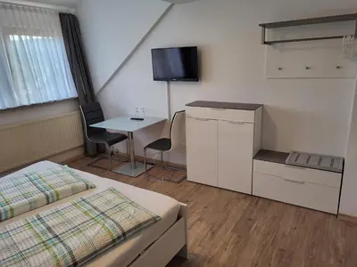 Ein Bett oder Betten in einem Zimmer der Unterkunft Pension am Wald
