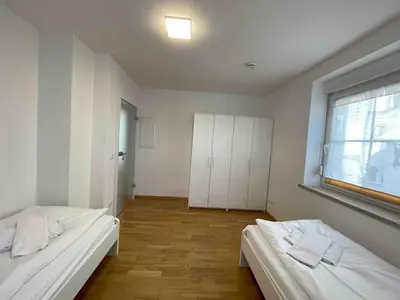 Ein Bett oder Betten in einem Zimmer der Unterkunft SAD241 Große Monteurwohnung Übergangswohnung