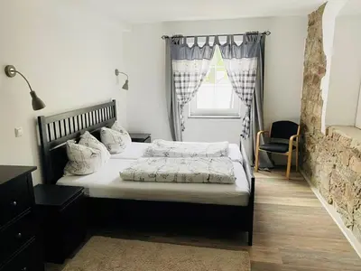 Ein Bett oder Betten in einem Zimmer der Unterkunft Ferienwohnung Kuhberg