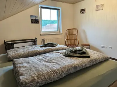 Ein Bett oder Betten in einem Zimmer der Unterkunft Ferienwohnung Zur Ochsenweid