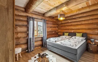 Ein Bett oder Betten in einem Zimmer der Unterkunft Blockhaus Chalet