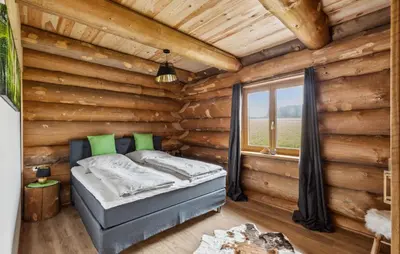 Ein Bett oder Betten in einem Zimmer der Unterkunft Blockhaus Chalet