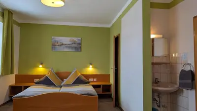 Ein Bett oder Betten in einem Zimmer der Unterkunft Gasthof Postgarten