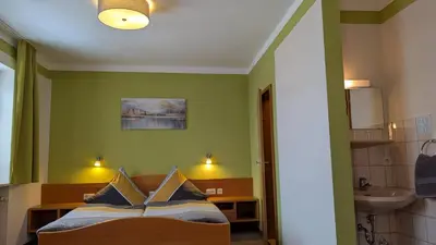 Ein Bett oder Betten in einem Zimmer der Unterkunft Gasthof Postgarten