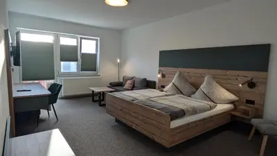 Ein Bett oder Betten in einem Zimmer der Unterkunft Gasthof Postgarten