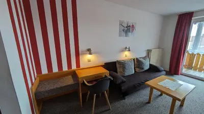 Ein Sitzbereich in der Unterkunft Gasthof Postgarten