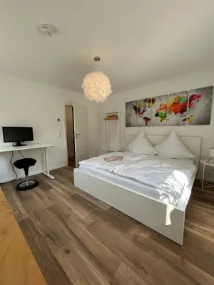 Ein Bett oder Betten in einem Zimmer der Unterkunft Mohla-Suite