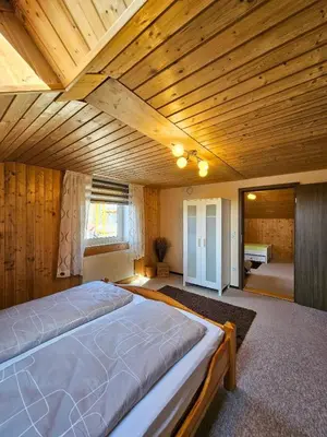 Ein Bett oder Betten in einem Zimmer der Unterkunft Ferienhaus Baumann mit Garten