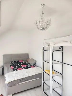 Ein Bett oder Betten in einem Zimmer der Unterkunft Ferienwohnung