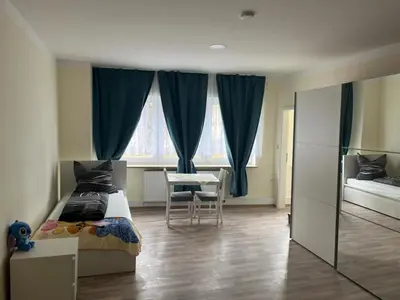 Ein Bett oder Betten in einem Zimmer der Unterkunft Ferienwohnung am Neumarkt