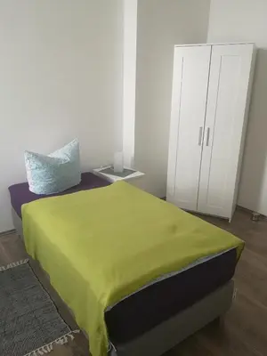 Ein Bett oder Betten in einem Zimmer der Unterkunft FeWo Vermietung Plauen