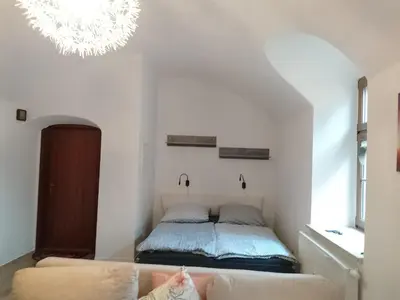 Ein Bett oder Betten in einem Zimmer der Unterkunft Zum Ritter Ferienwohnung 500 Meter zum Freizeitpark Plohn
